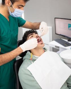 Male patient attending dentist to get orthodontic treatment and solve his teeth problems with invisible aligners from Eon Aligner